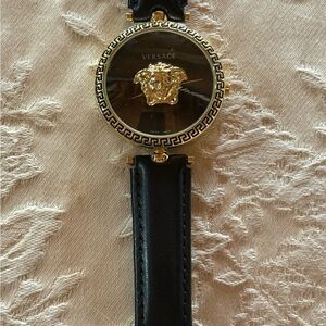 Versace Women's Black and Gold Watch